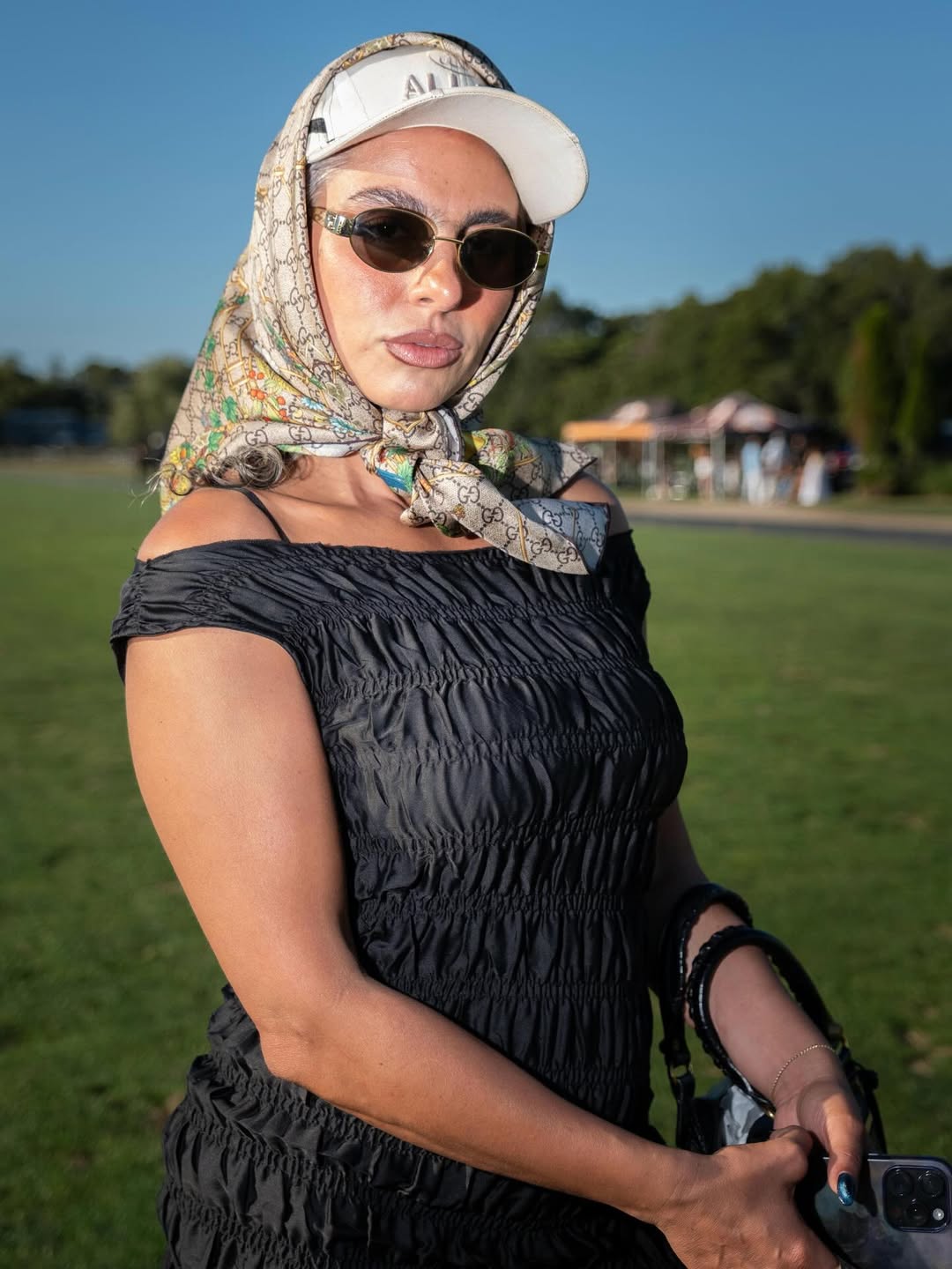 Guest in headscarf and sunglasses